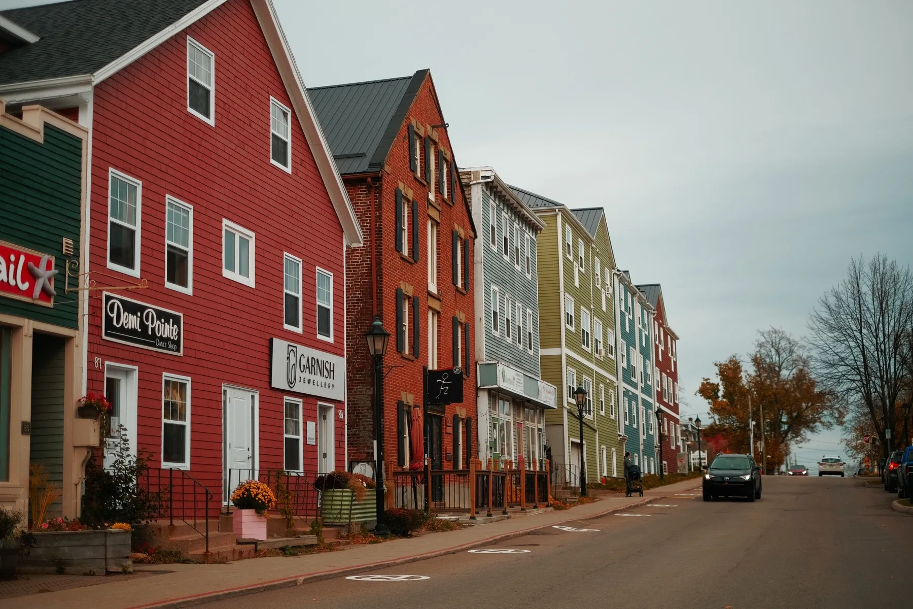 A row of colourful heritage buildings on a street in Charlottetown, in autumn.